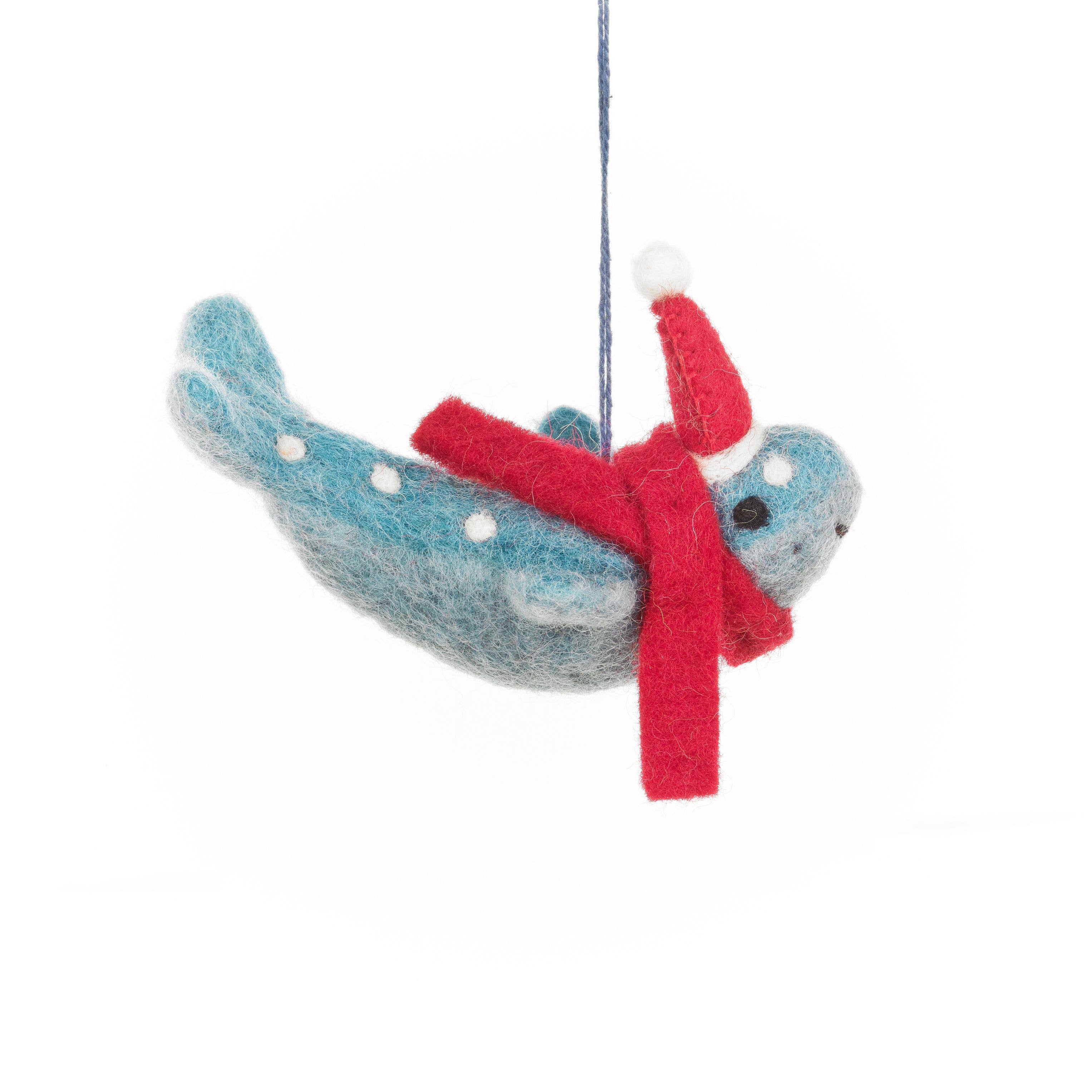 Felted narwhal ornament with a red scarf 