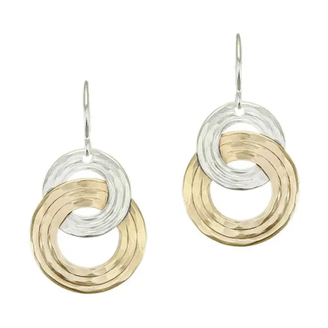Close-up view of Interlocking Rings Wire Earrings in brass and silver with ripple texture, showcasing modern sculptural design by Marjorie Baer.