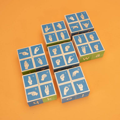 Close-up of a debossed Uncle Goose American Sign Language Block displaying the letter 'A', showing kids that fingerspelling is as easy as pie—sweeten your vocabulary with this fun educational toy!