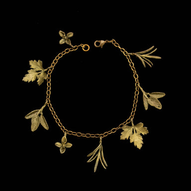 Petite Herb Charm Bracelet by Michael Michaud showcasing intricate botanical designs with a soft patina finish on bronze, capturing the essence of nature.