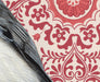Detailed view of the Chickadee's wing and the ornate floral wallpaper in the illustration by Emily Uchytil, highlighting fine art techniques.