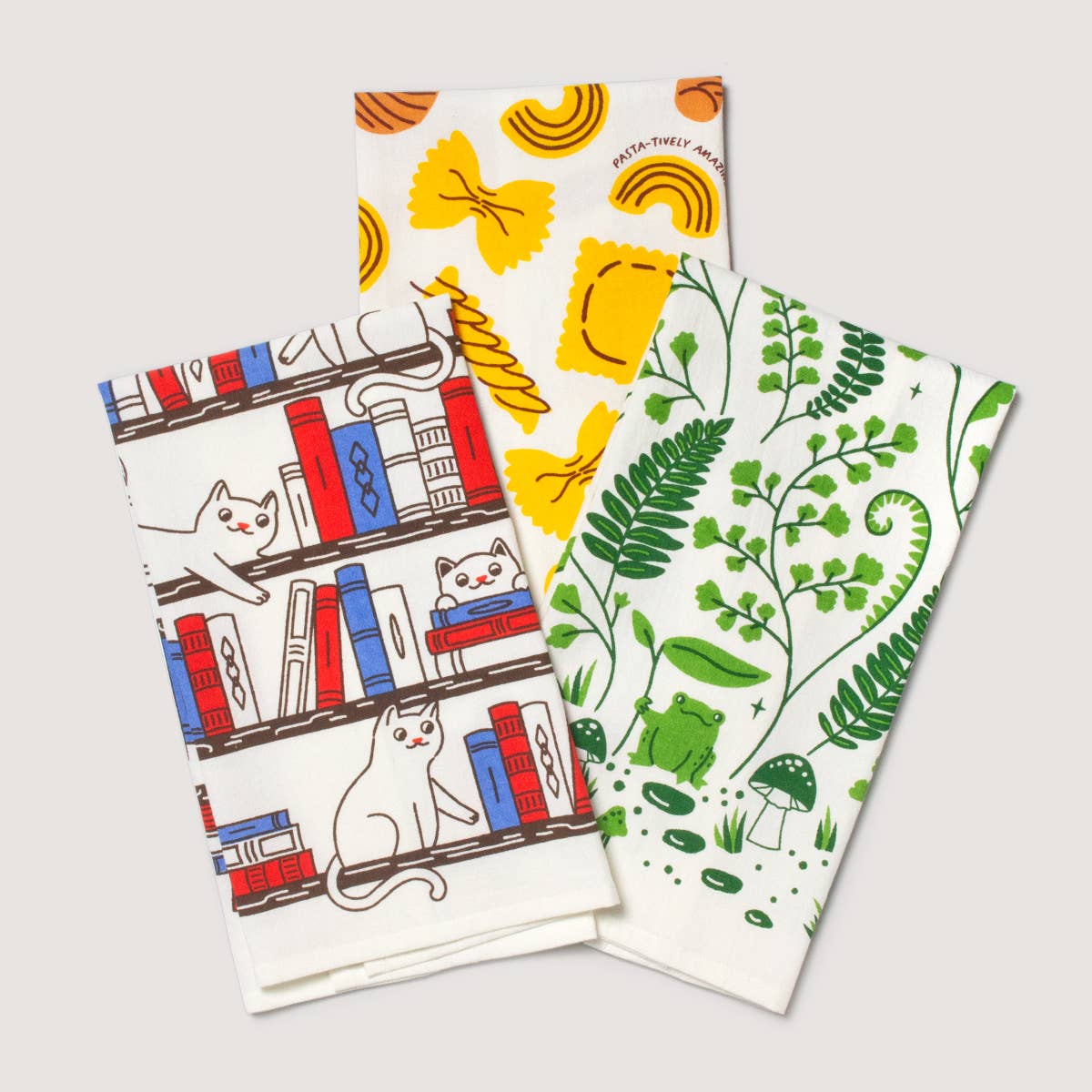 Cat on a bookshelf tea towel