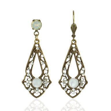Opalina Crystal Earrings by Anne Koplik Designs featuring a vintage-inspired design with a white opal crystal centerpiece and accentuated by ornate brass detailing. Perfect for versatile occasions.