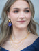 Stylish display of Atlas Earrings - because every fashionista needs a gold sun and a dash of cosmic charm!