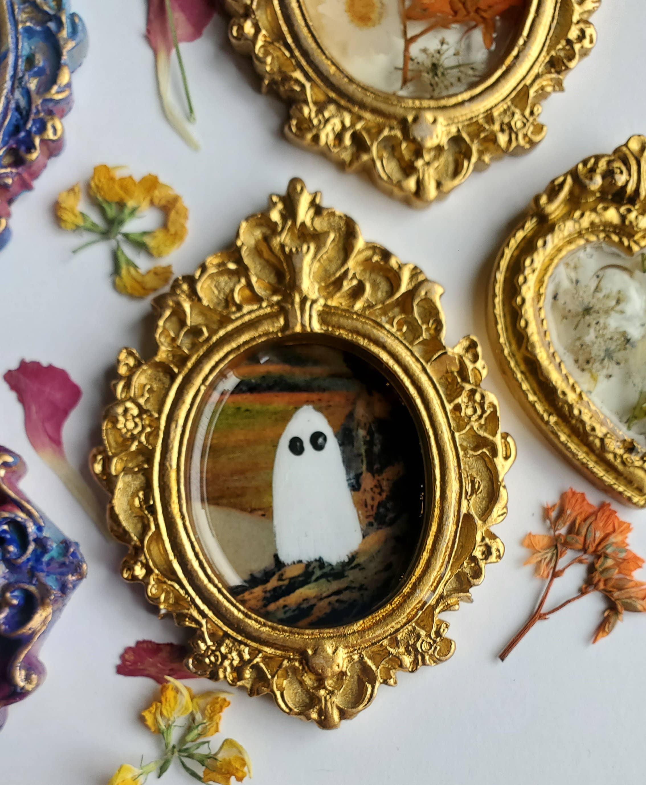 Ghosts on vacation in gold mini frame