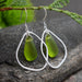 Close-up view of Green Eco Glass Teardrop Frame Earrings highlighting recycled glass drops and elegant design.