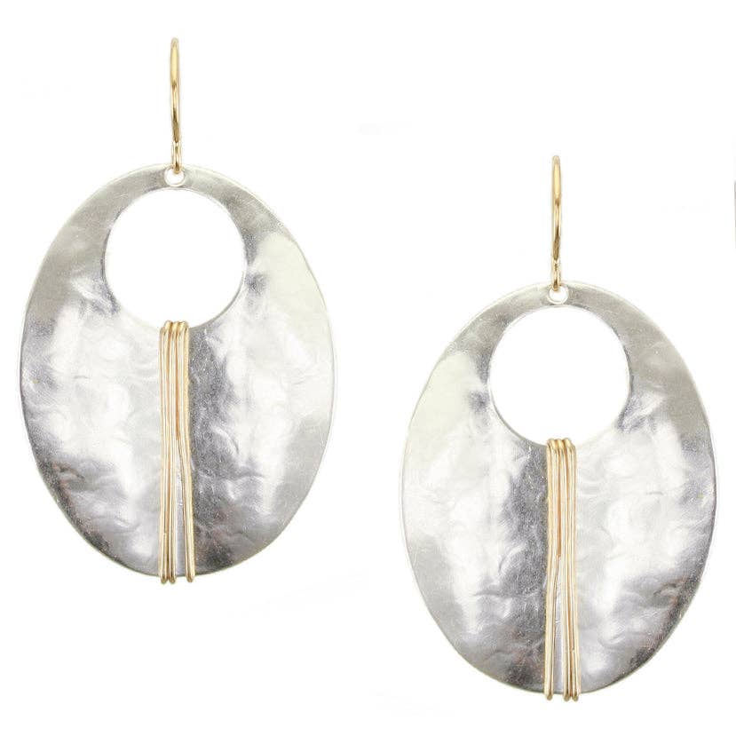 Large Wrapped Oval Wire Earrings featuring a silver cutout oval design with brass wire wrapping in the center. Elegant and sculptural jewelry piece.