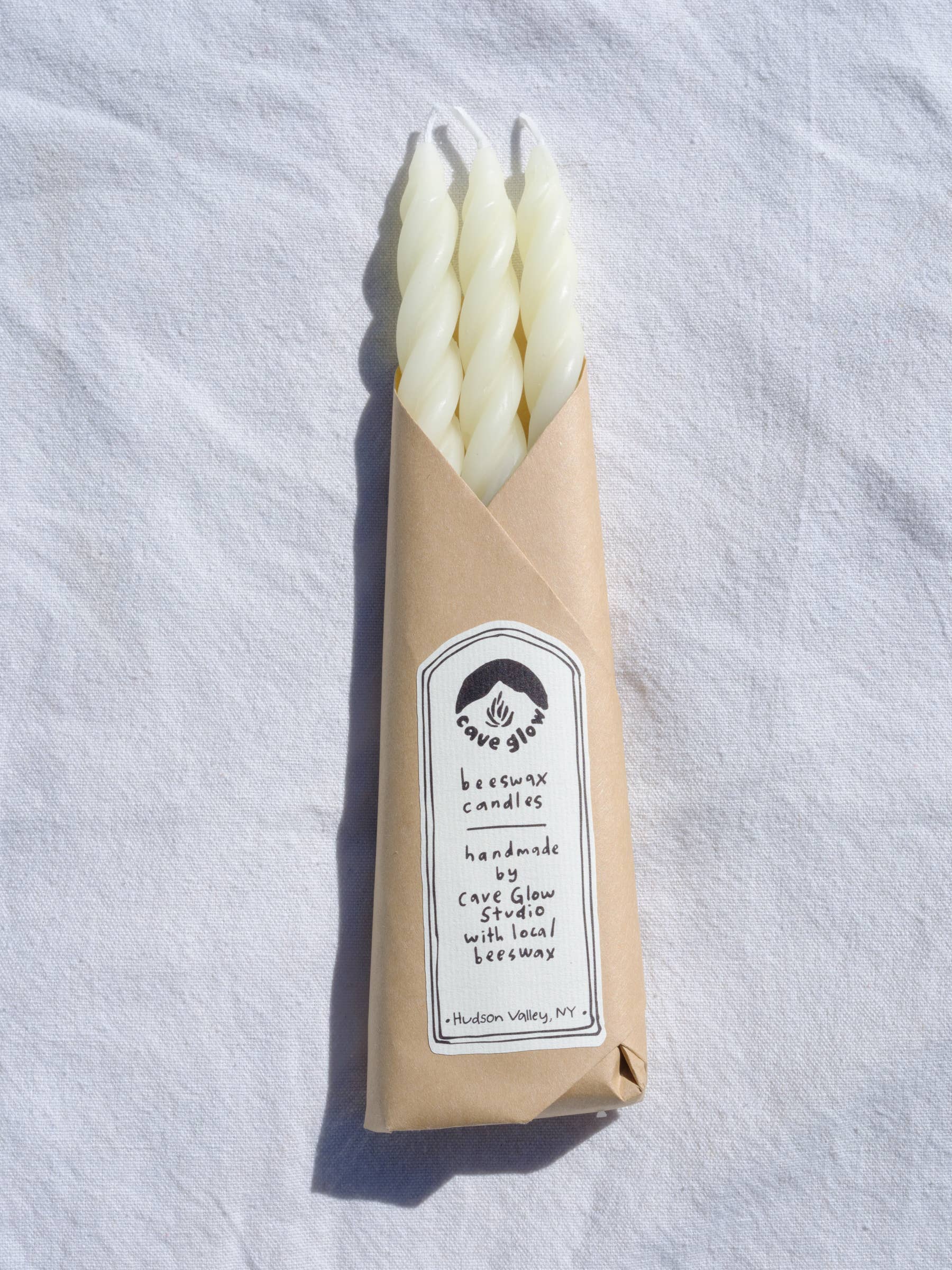 white Wrapped Beeswax Spiral candles by Cave glow studio