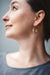 woman wearing Kinetic circle earrings