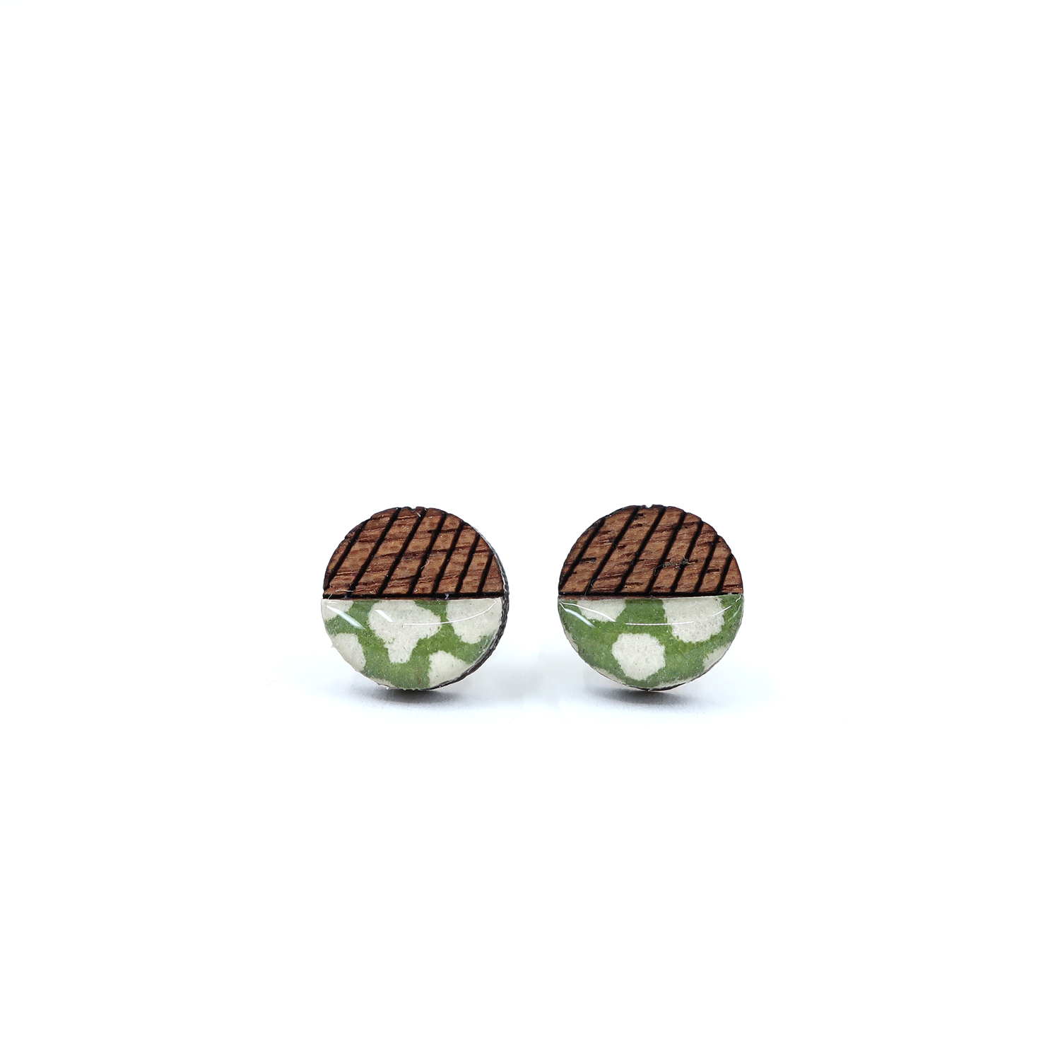 Close-up of mini geometric color block titanium studs, featuring laser-cut solid wood and UV-cured resin.