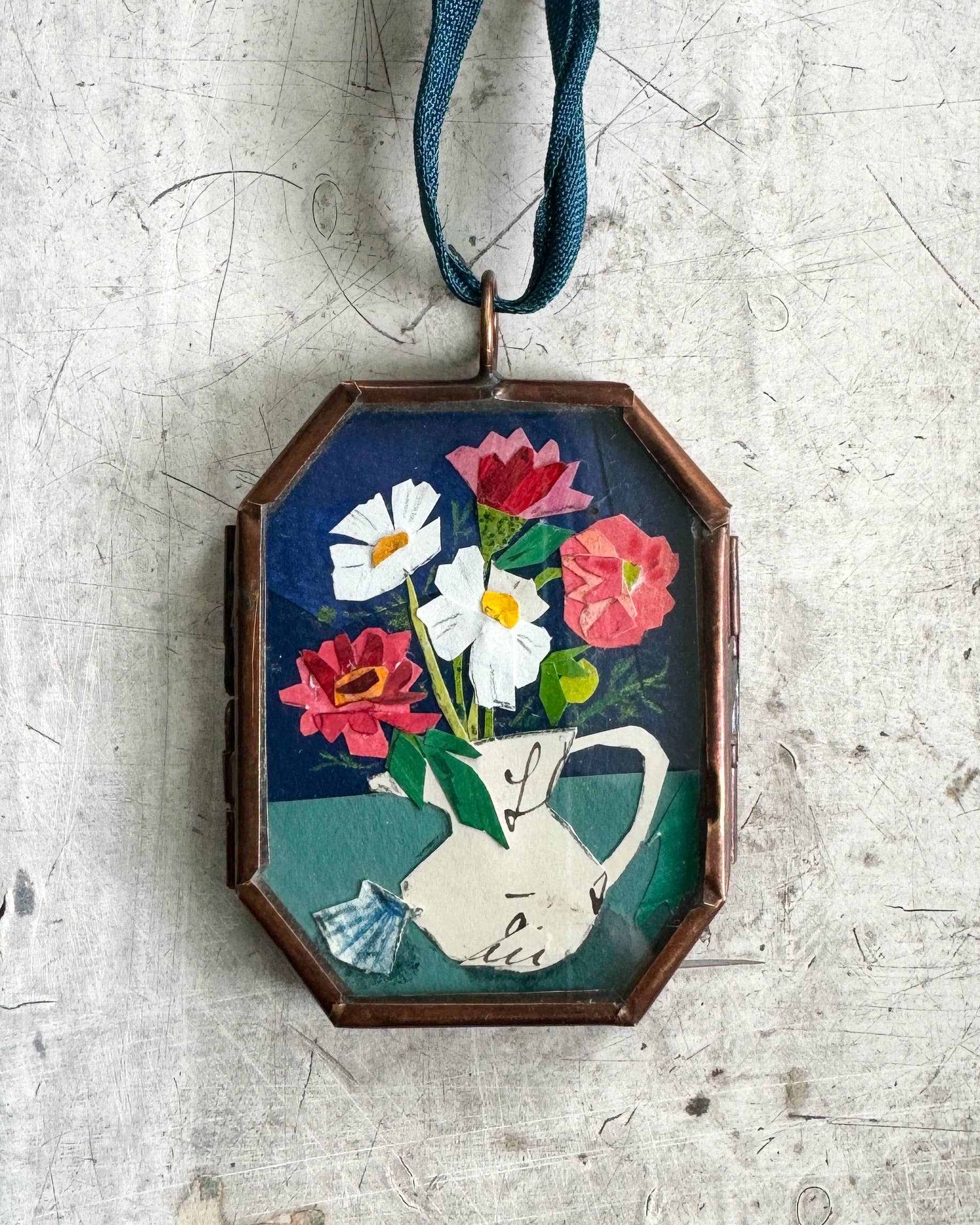 Vintage-style flowers in a vase pitcher art locket ornament.