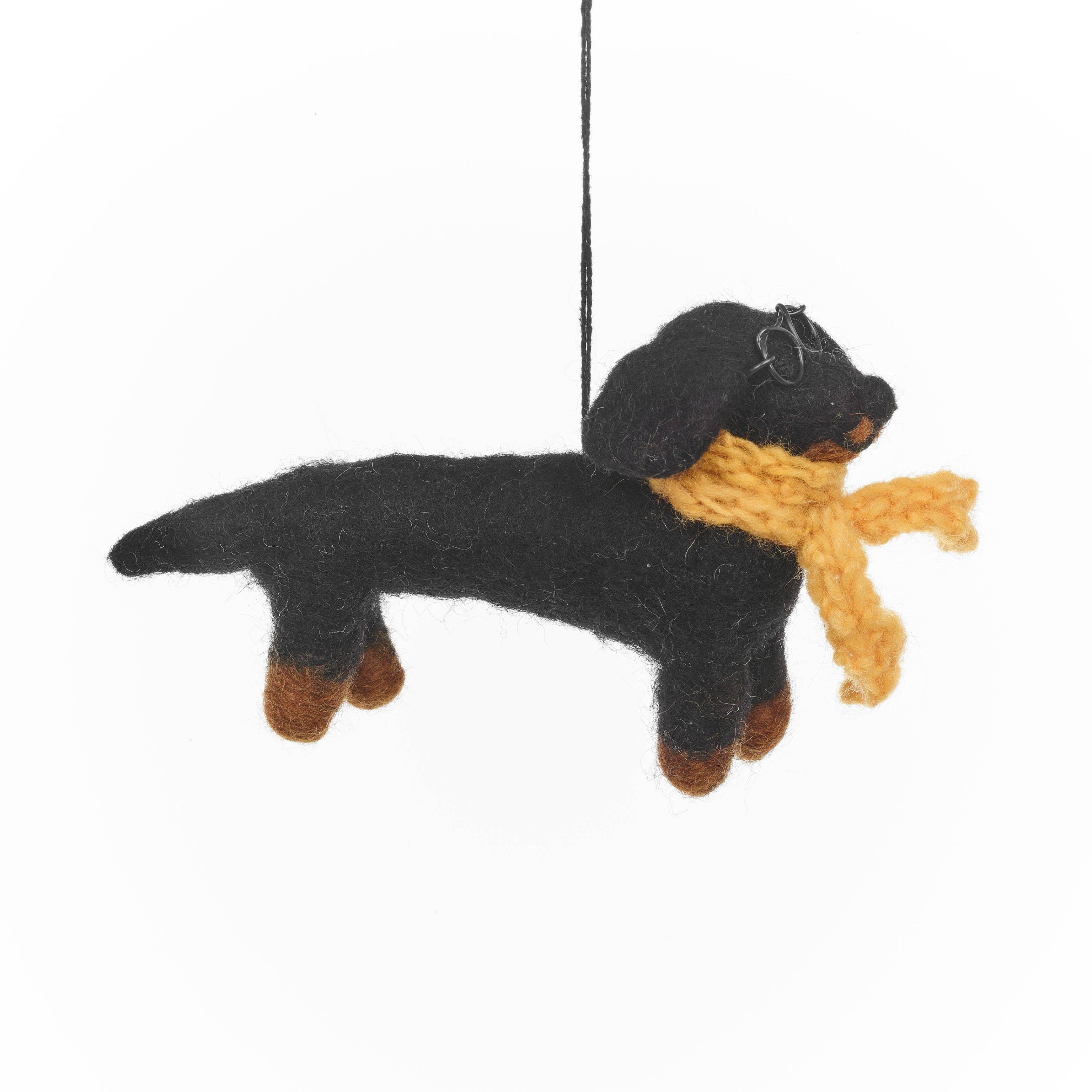 Felt Black and brown dog ornament with a yellow scarf