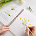 Spring watercolor workbook cover showcasing colorful floral illustrations designed for both kids and adults.