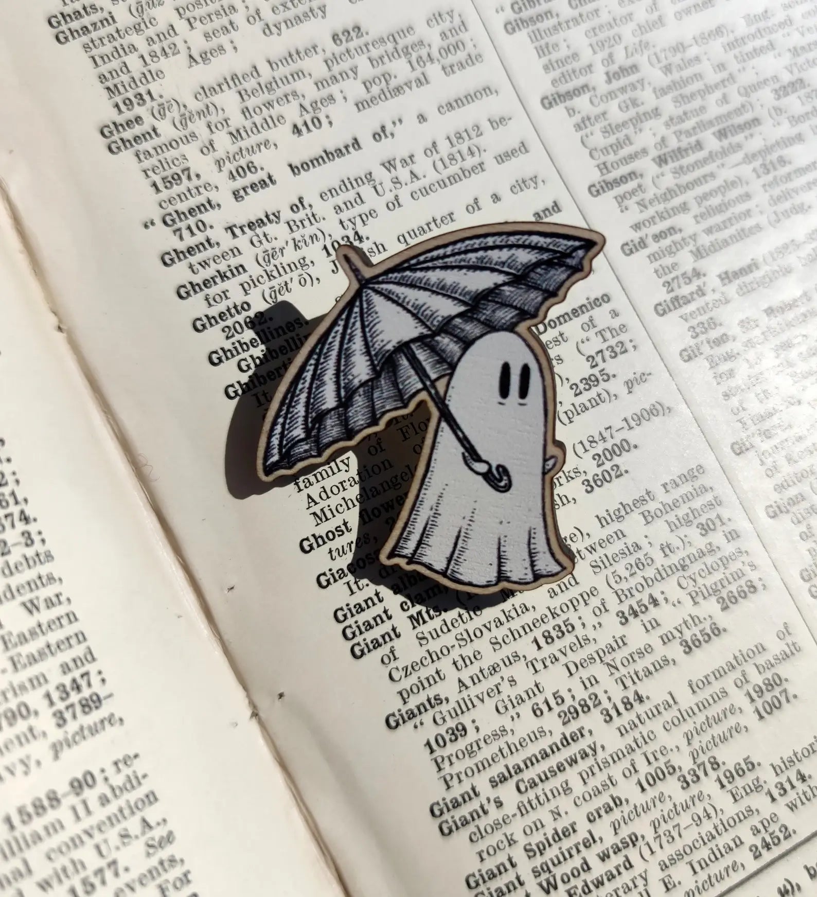 wood ghost pin carrying an umbrella