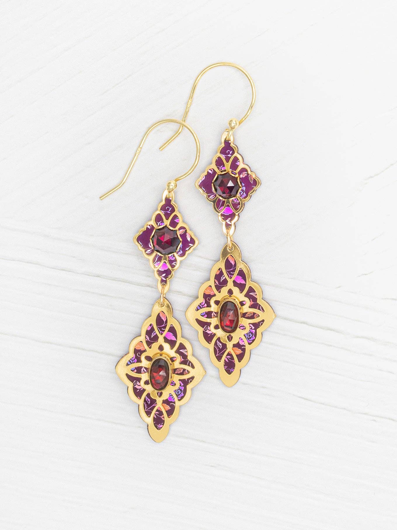 Esmeralda Earrings: Dazzling design featuring garnet ovals and niobium florals – because why just shine when you can spark joy in 18K gold-plated elegance?