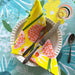 Close-up of Allium Napkin Set, showcasing vibrant colors and cheerful patterns on 20x20 inch napkins.