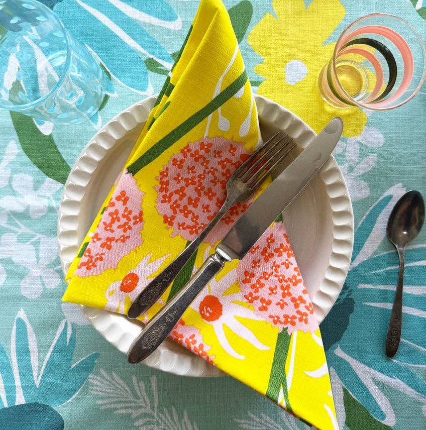 Close-up of Allium Napkin Set, showcasing vibrant colors and cheerful patterns on 20x20 inch napkins.