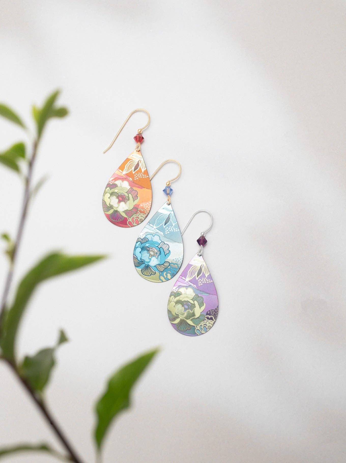 Close-up of Cynthia Earrings by Holly Yashi, capturing a floral dream in niobium – because your love life deserves these sparkling gems!