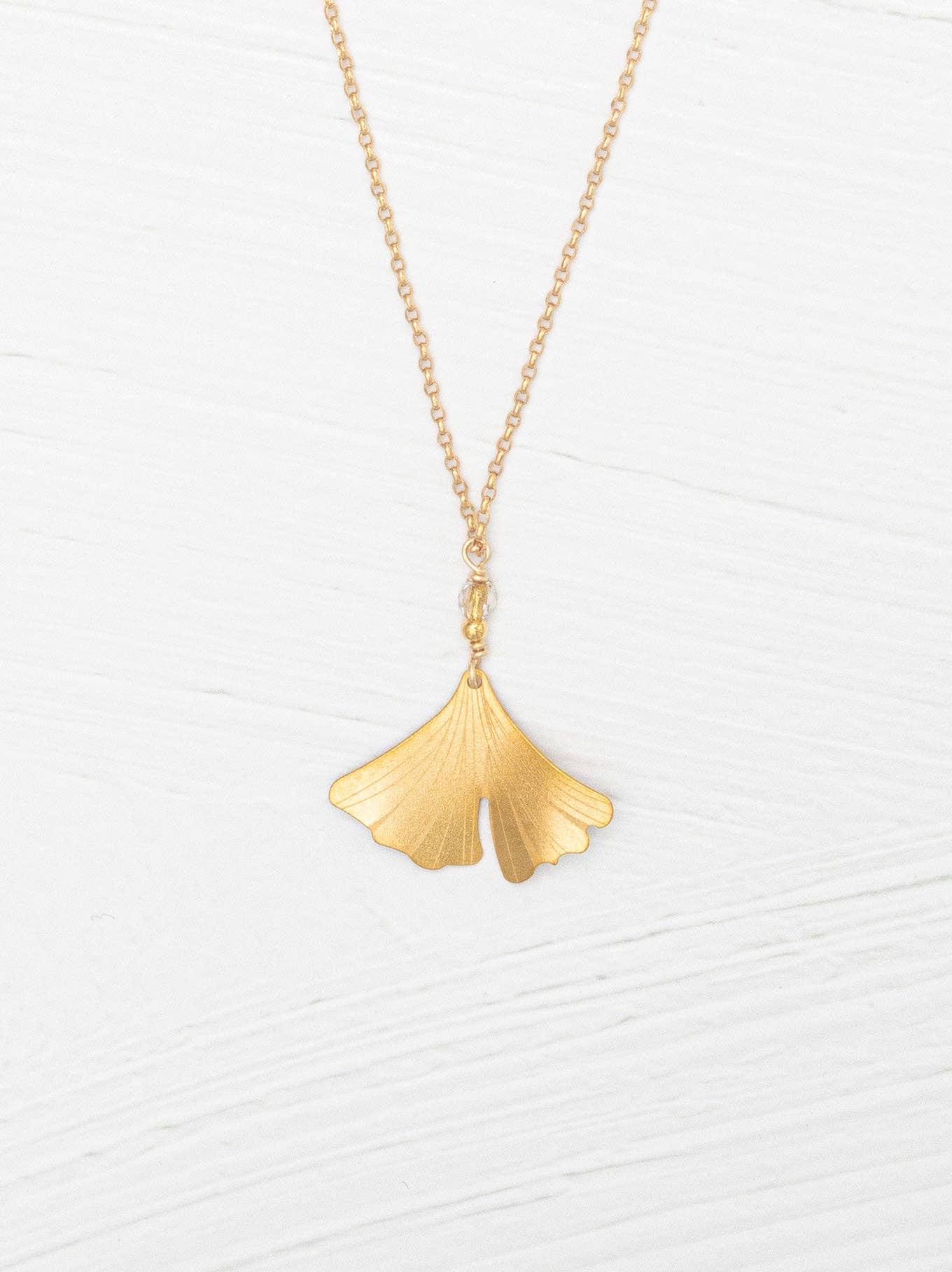 Enjoy the single life with the Petite Ginkgo Pendant Necklace, featuring a stunning golden niobium leaf that brings a touch of whimsy to your jewelry collection!