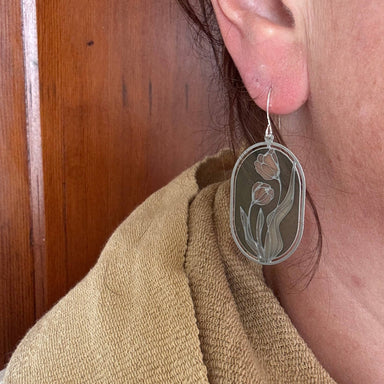 Close-up of Camellias Stained Glass Resin Earrings by Wild Lupine Folkcraft worn by a model, highlighting the elegant design and lightweight comfort of these handmade earrings.