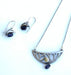 steel jewelry with black gemstones