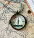 Vintage-style nautical boat art locket ornament.