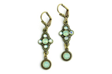 Pair of drop antiqued earrings with turquoise stones and gold accents 