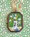 Vintage-style tulips art locket ornament.