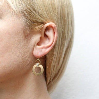 Close-up view of Medium Double Linked Rings Wire Earrings by Marjorie Baer, highlighting the elegant brass and silver finish and unique double linked ring design.