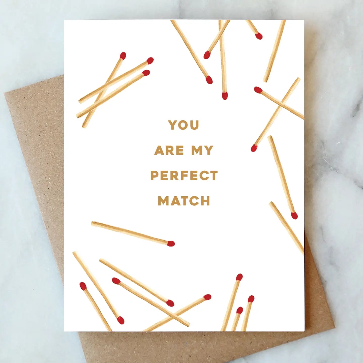 Valentine's Day Card Collection depicting scattered matchsticks with the caption 'YOU ARE MY PERFECT MATCH' by ARTISANS & agency.