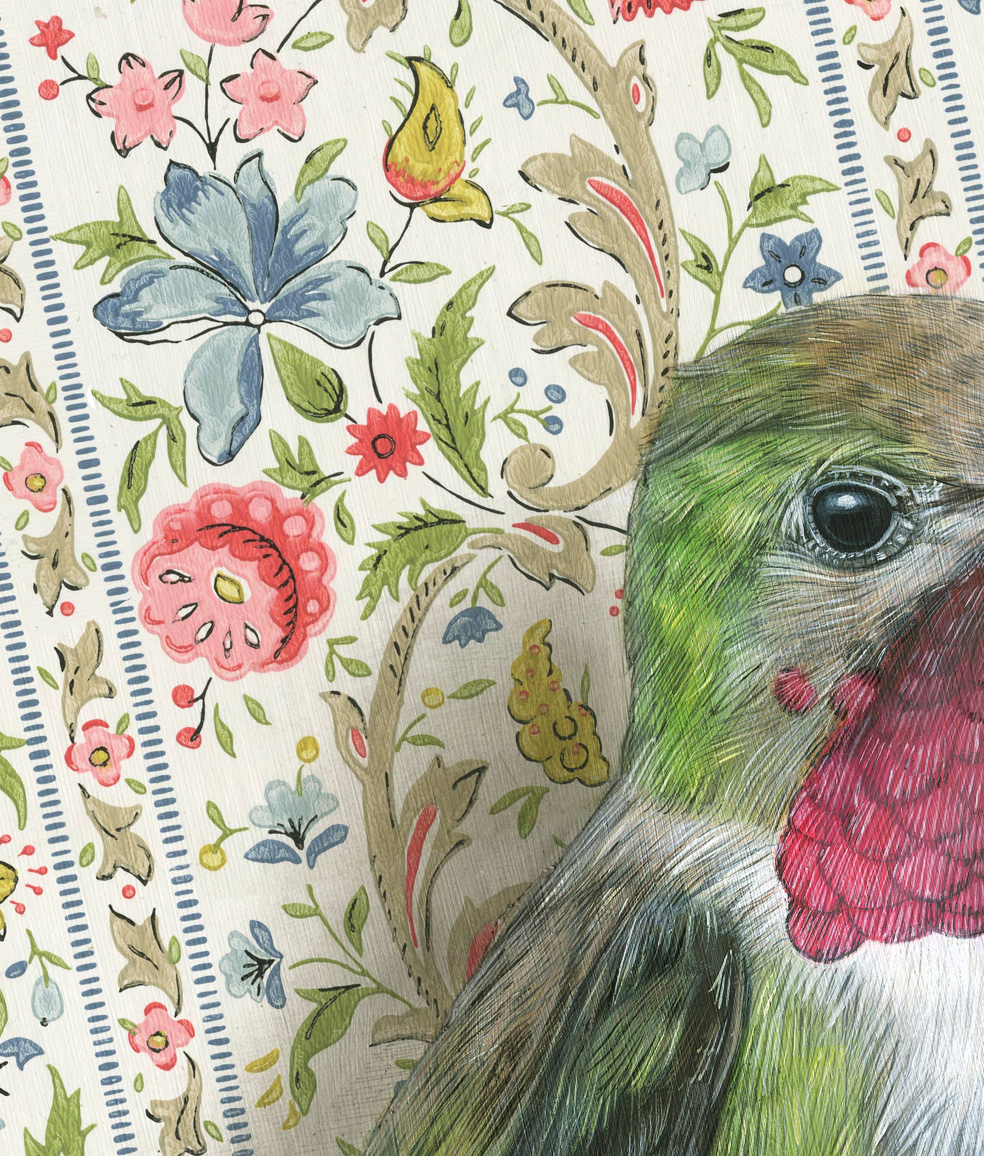 Framed art print of a hummingbird on a floral patterned background.