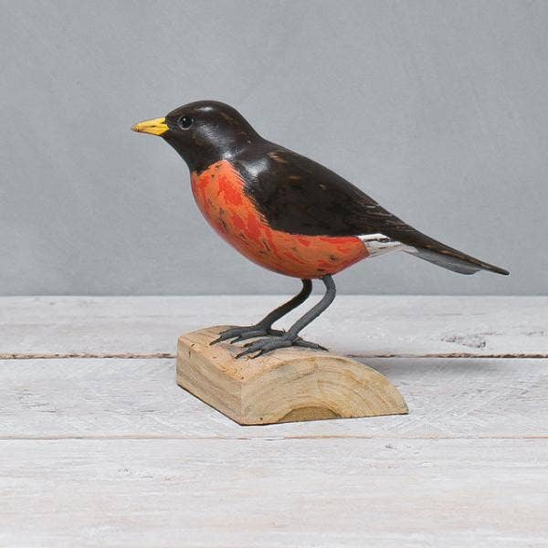 painted wood robin on stump