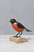 painted wood robin on stump