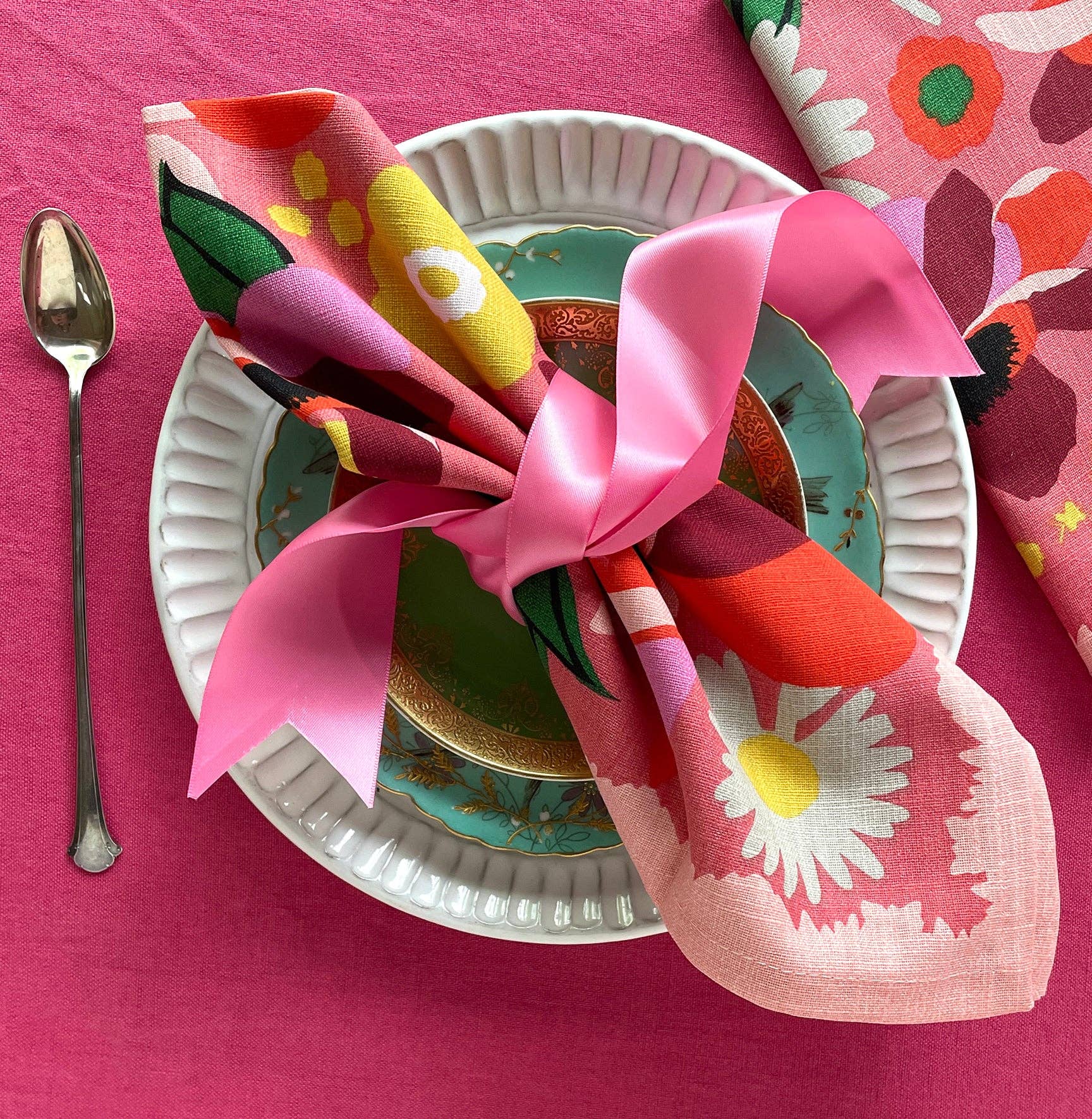 Garden Napkin Set of 4 folded elegantly, ideal for vibrant table settings.