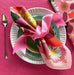 Garden Napkin Set of 4 folded elegantly, ideal for vibrant table settings.