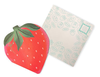 Close-up of a strawberry-shaped notecard from the Paper Produce Strawberry Notecards collection by Chronicle Books, showcasing the detailed design alongside a coordinating patterned envelope.