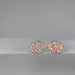 Pair of rose gold floral-shaped earrings