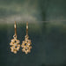 Gold drop earrings with gemstones 