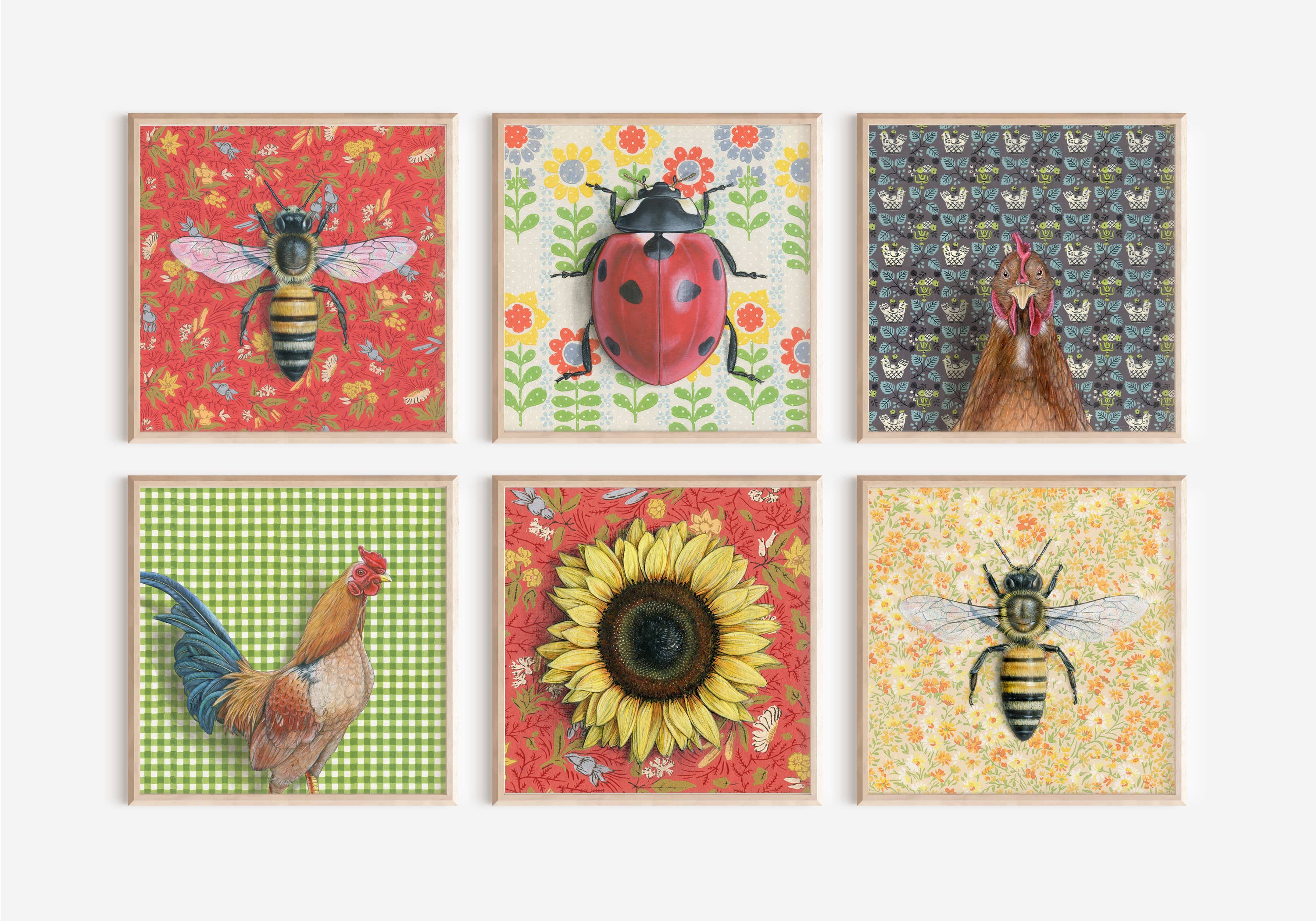 Collection of framed fine art prints, including the Honeybee Red illustration by Emily Uchytil, showcasing various nature-themed designs in a vibrant display.