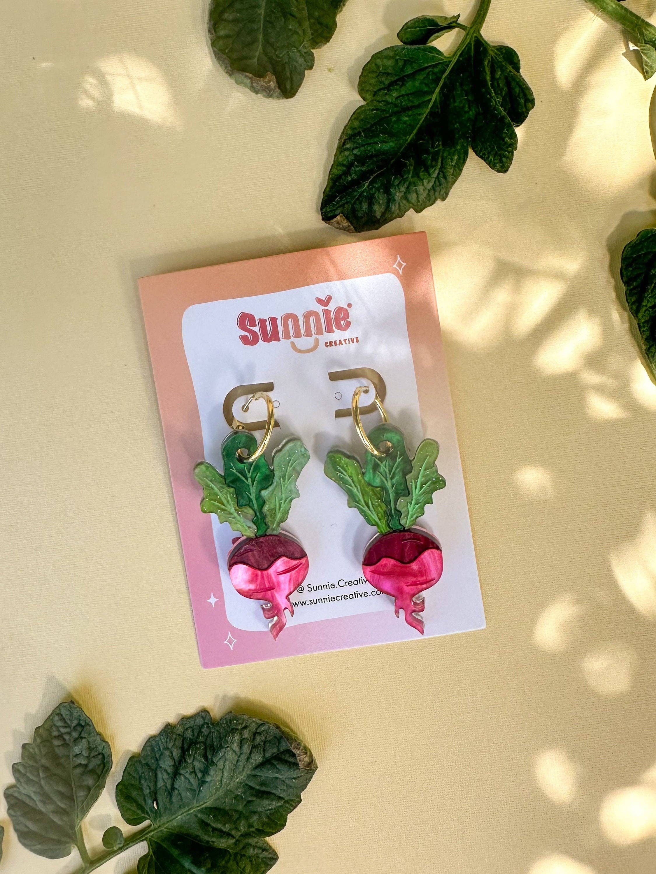 Ruby Radish Dangle earrings by Sunnie Creative, presented on a stylish card, showcasing the unique handmade design and vibrant colors.