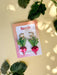 Ruby Radish Dangle earrings by Sunnie Creative, presented on a stylish card, showcasing the unique handmade design and vibrant colors.