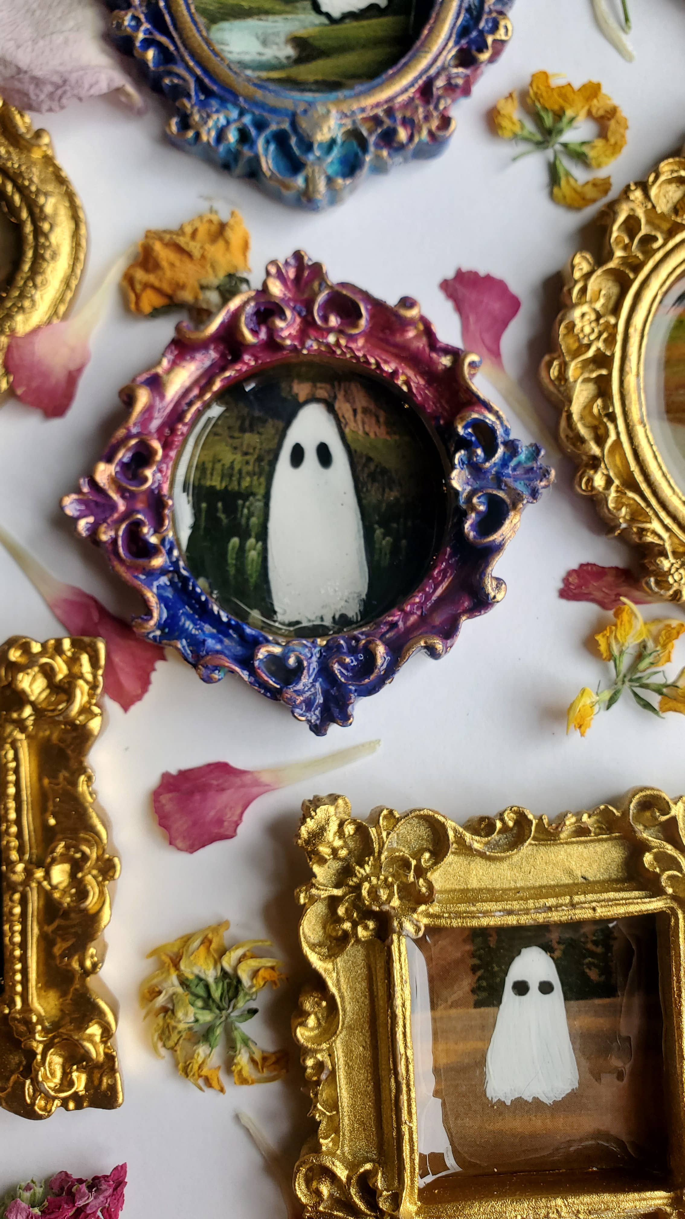 Ghosts on vacation in gold mini frame