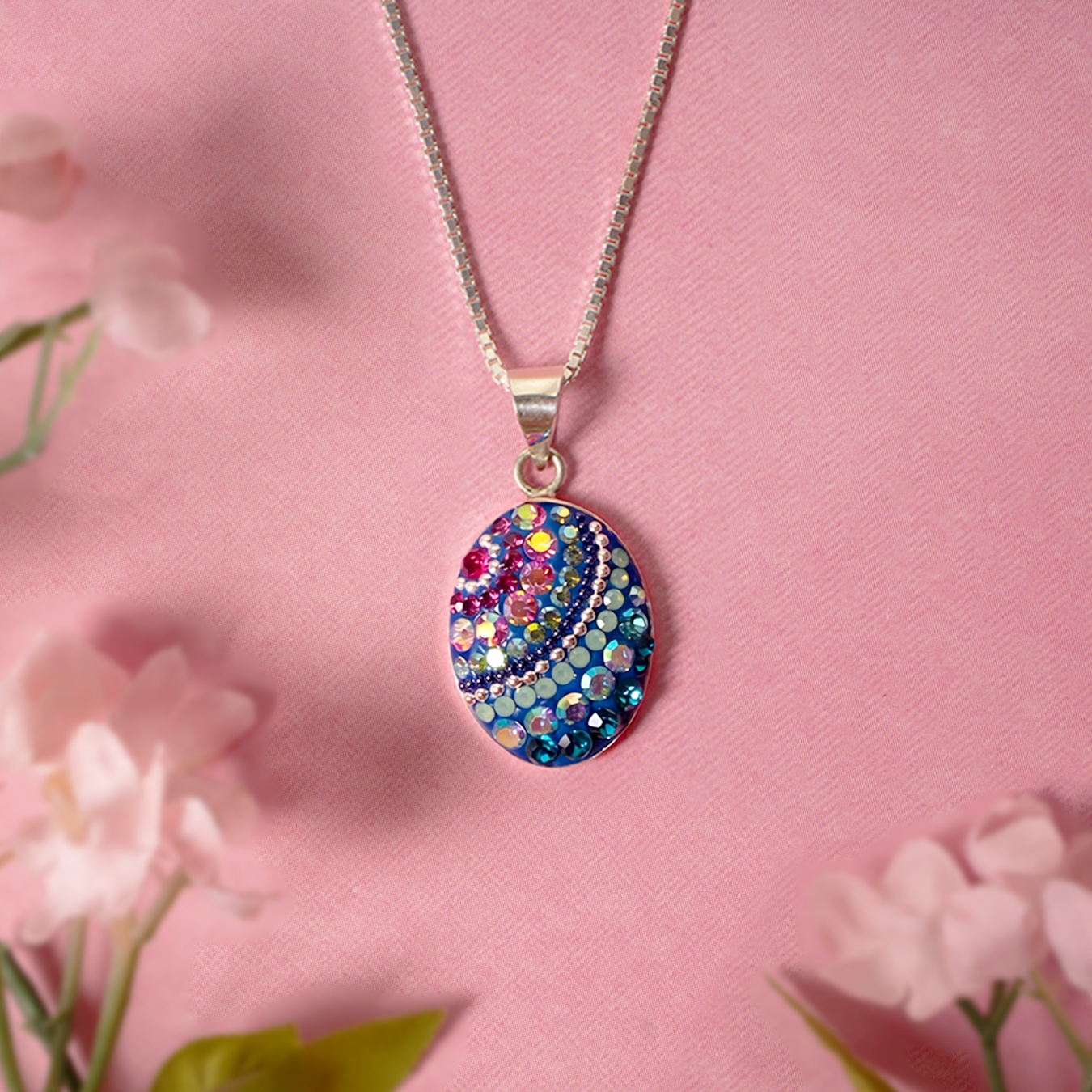 Elegant Mosaico Jewels Petite Oval Pendant in Crystal & Silver with vibrant colors, ideal for chic accessorizing.