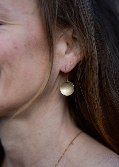 woman wearing Small bowl earrings