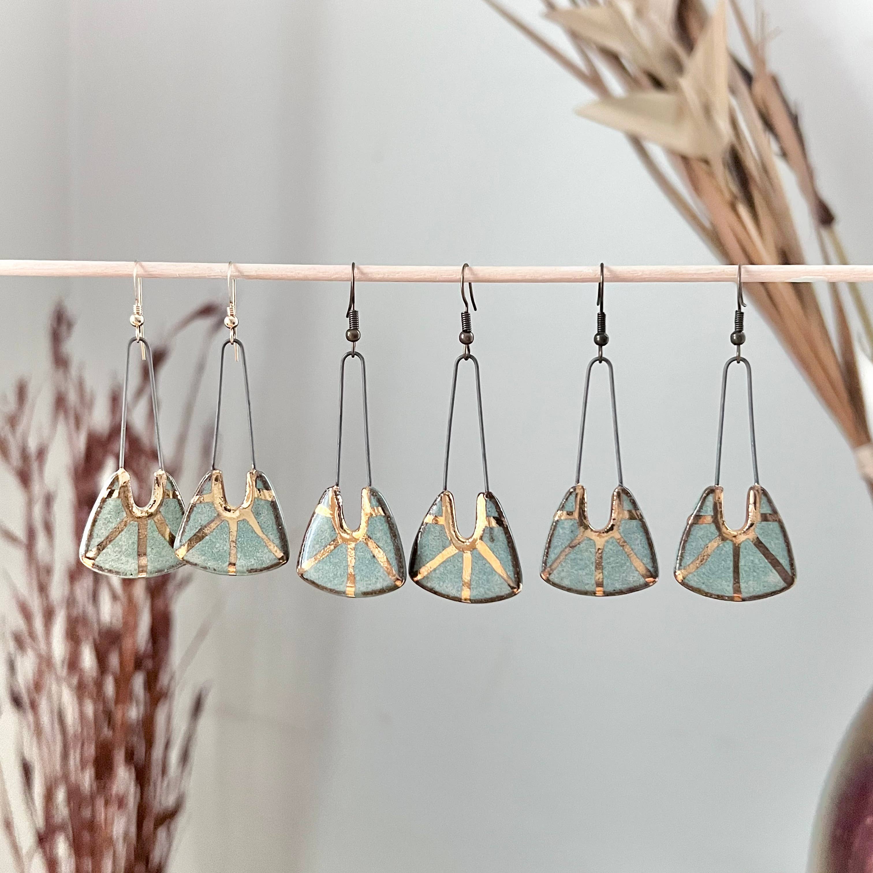 Turquoise Dropped Stoneware Earrings with Gold Sun Design