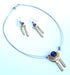 wire necklaces and earrings featuring blue beads and acrylic gemstones