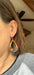 Display of Boho Large Open Teardrop Fire Painted Copper Earrings on a decorative card, emphasizing their unique artisan quality.