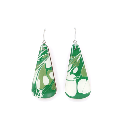 Detailed view of the green and white mid century modern long earrings showcasing the UV-cured resin finish and unique marbled pattern.
