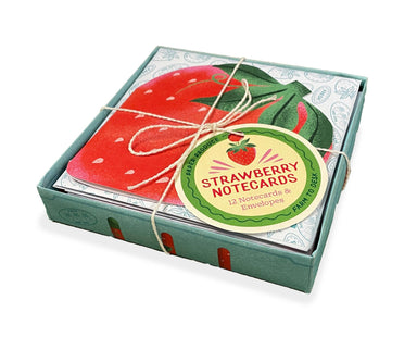 Charming Paper Produce Strawberry Notecards by Chronicle Books, featuring vibrant die-cut strawberry-shaped cards and coordinating berry-patterned envelopes, wrapped in twine and presented in a delightful fruit carton.