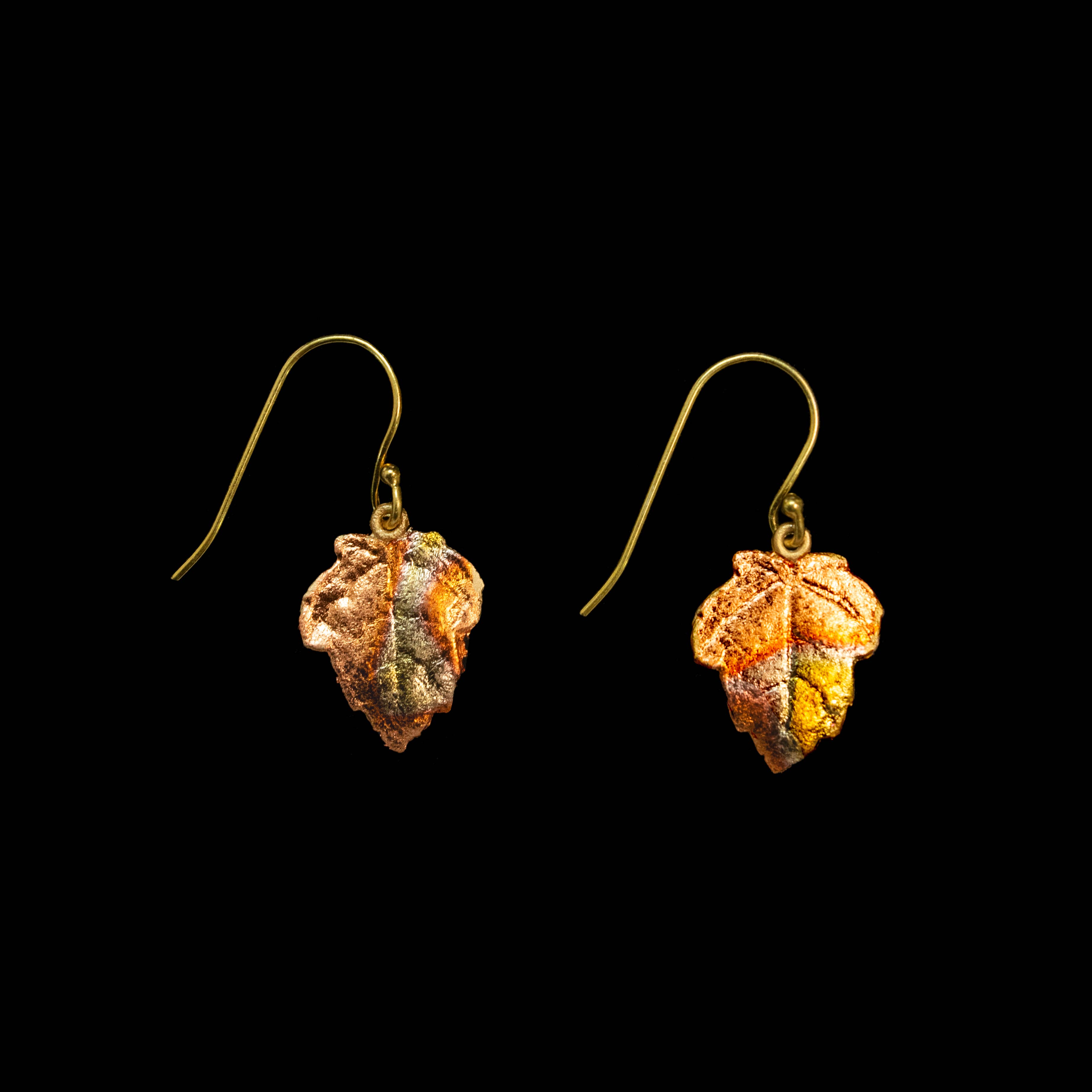 Handcrafted Sugar Maple Wire Earrings featuring a beautiful cast bronze design with a rich brown and green patina finish, accented with 24K gold and copper leaf for a stunning look.